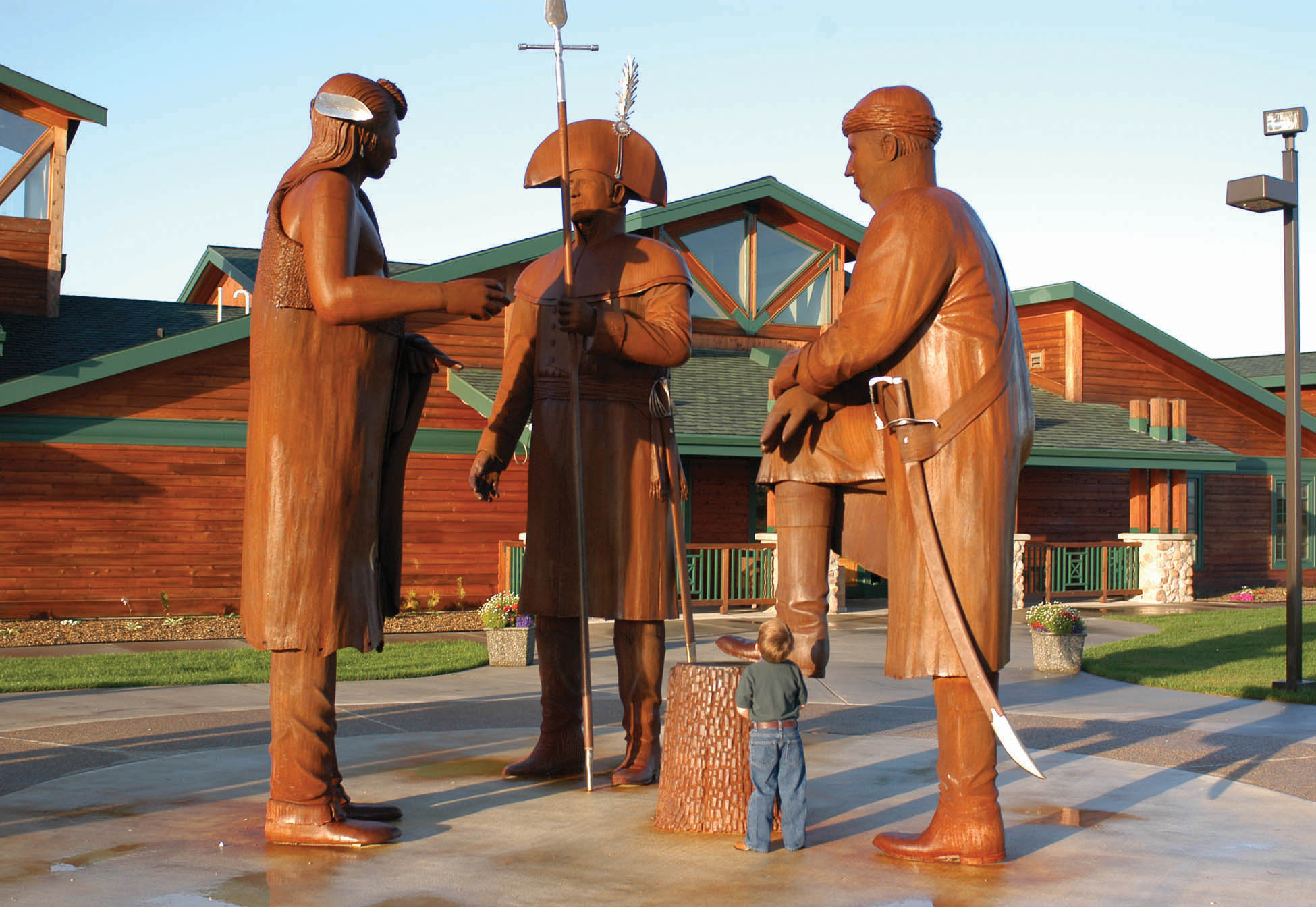 12‐foot‐tall steel statues of Lewis, Clark, and Mandan Chief Sheheke greet visitors