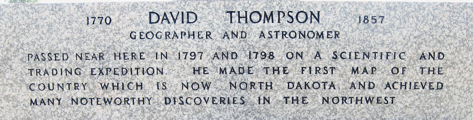 The inscription at the base of the David Thompson Memorial.