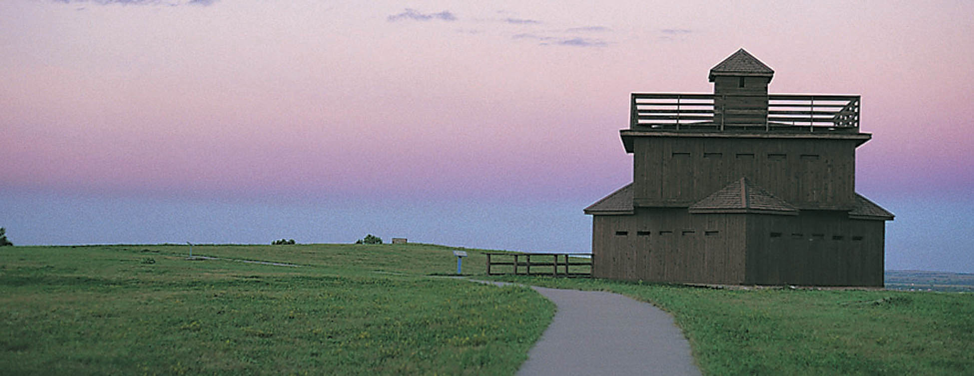 <strong>Figure 85. Reconstructed blockhouses at Fort Abraham Lincoln</strong> south of Mandan, North Dakota. <em>(ND Tourism, WE0038)</em>