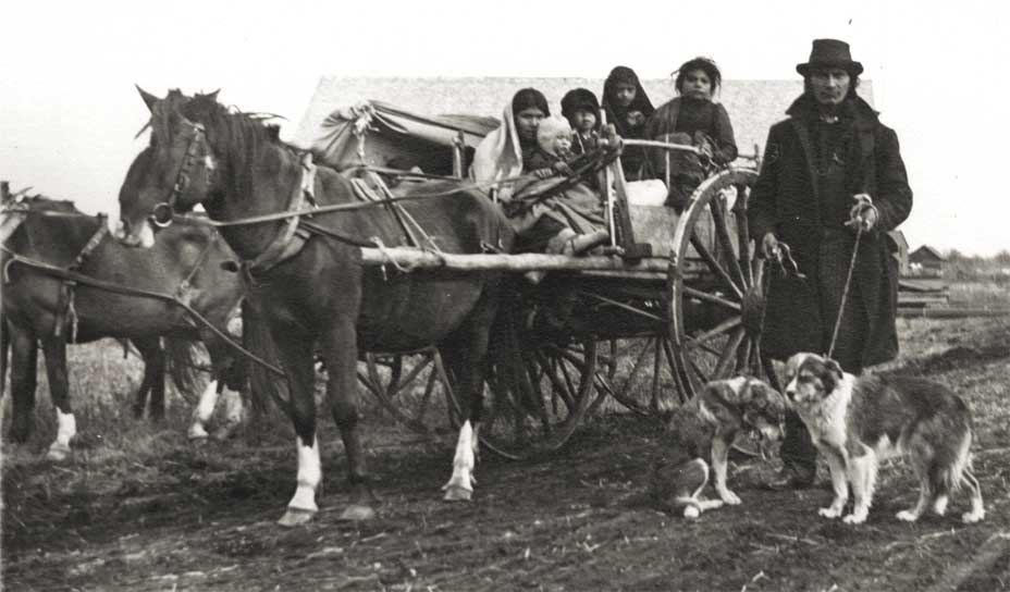 A Chippewa family shown with a Red River cart