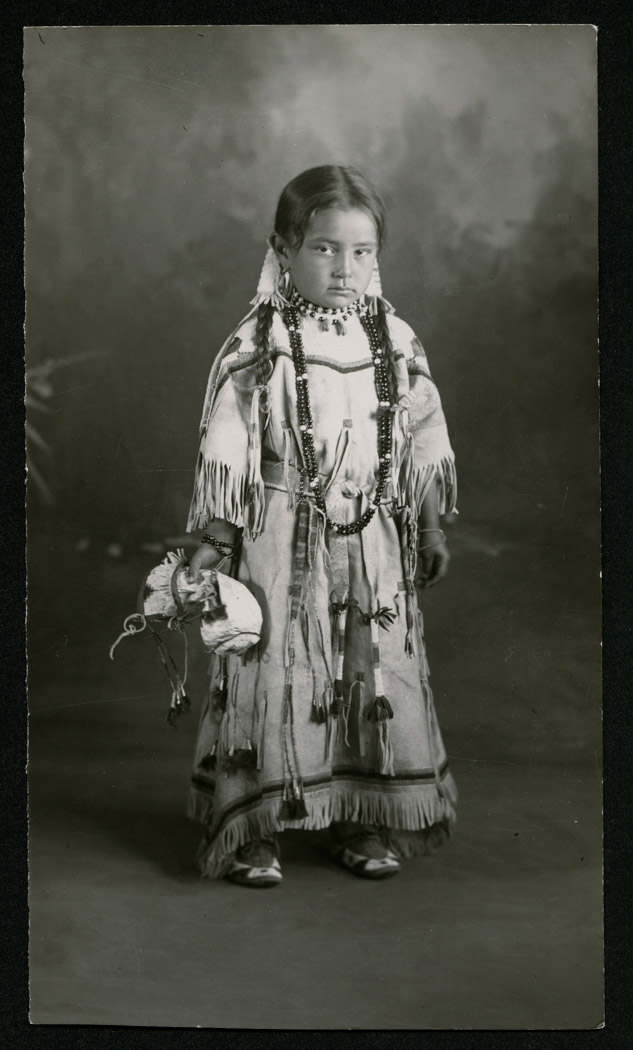 Young girl in beaded leather dress