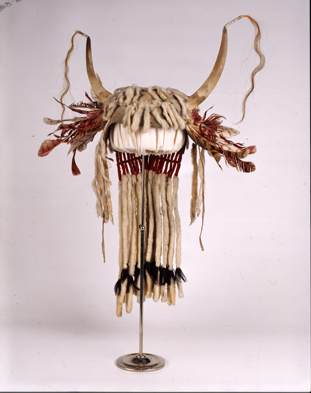 “Weasel Tail Headdress.”  This very special headdress was decorated with weasel tails.  It would have been worn for ceremonies.  This headdress was owned by Crazy Dog. SHSND Museum 00973