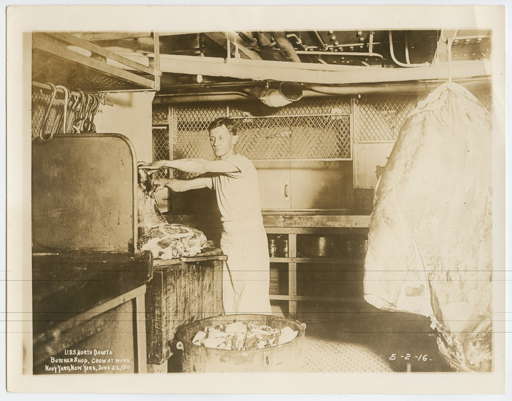 This young seaman’s duty was to prepare meat for the men’s meals.