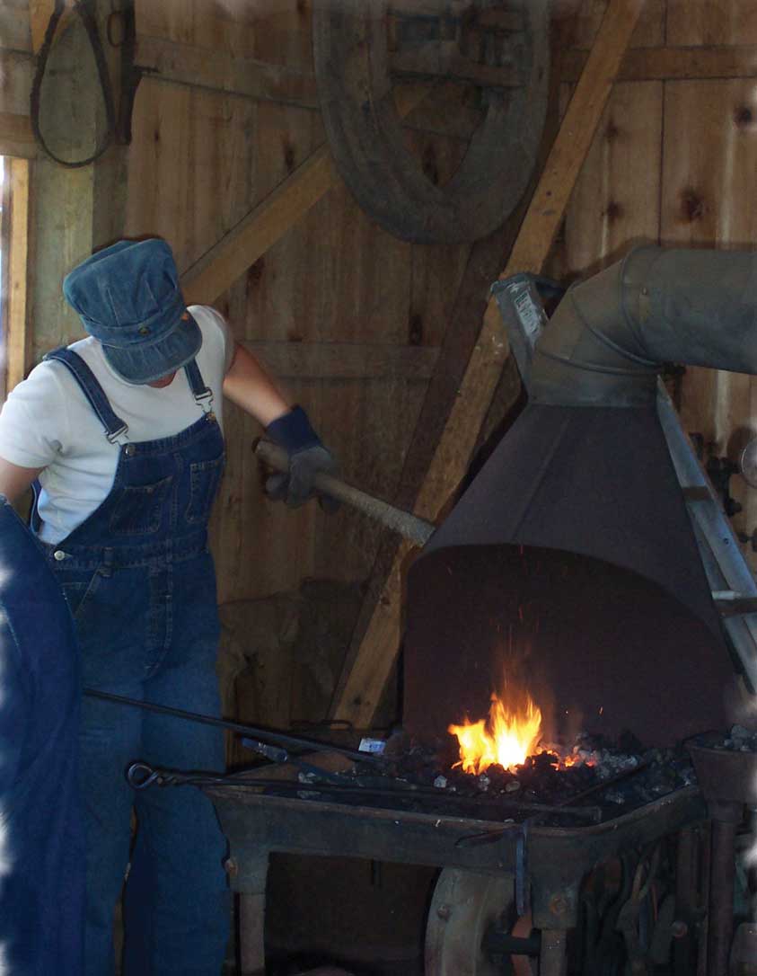 Figure 28. This man demonstrates the skill of blacksmithing