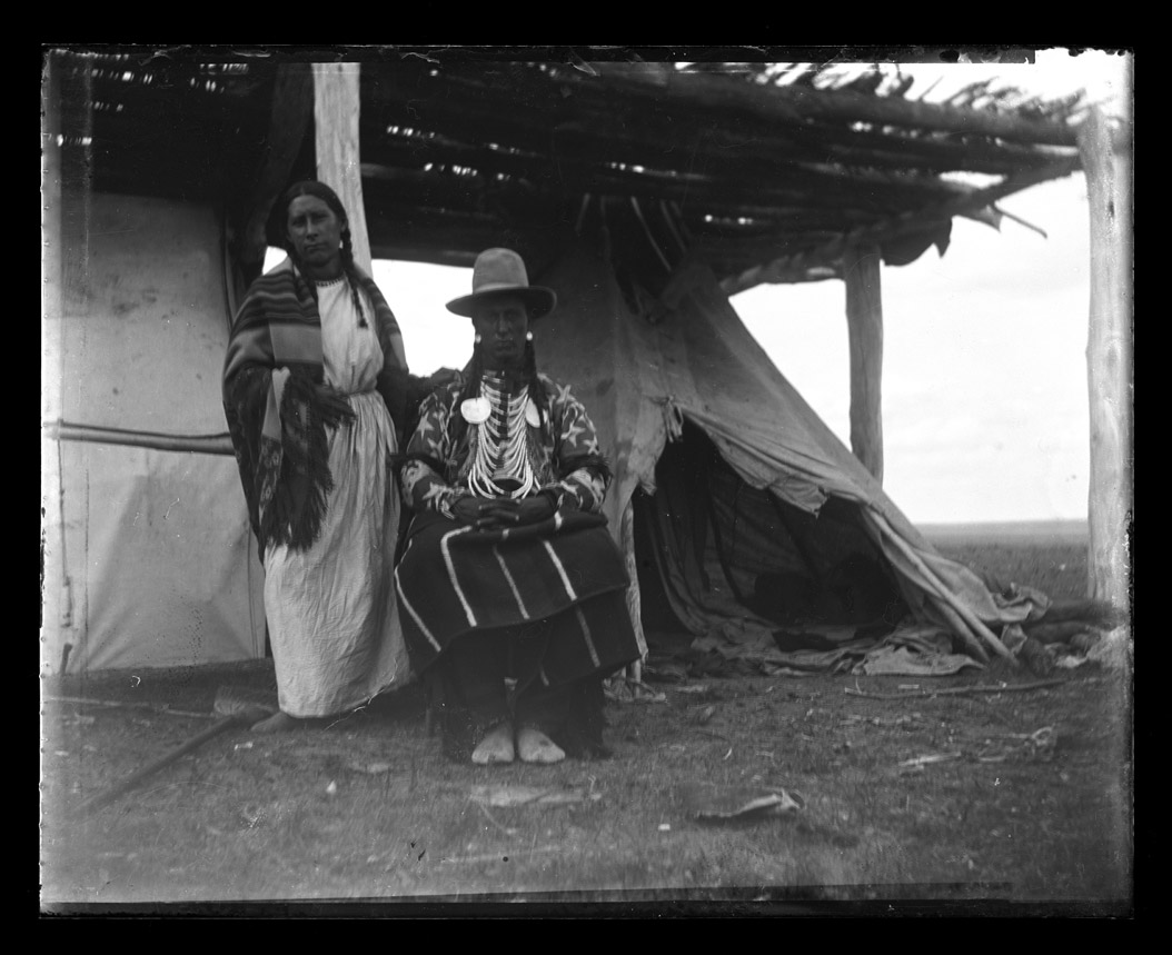 Birds Bill poses with his wife.  Birds Bill created the pictograph (#01100 in Image 12) story of the bison hunt. SHSND 0270-048