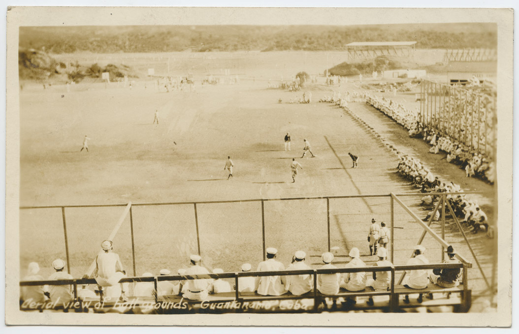 Officers and enlisted men watch the North Dakota’s baseball team play