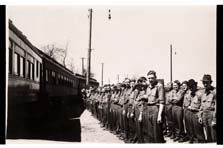 Civilian Conservation Corps (CCC) members getting ready to leave Fair Park (Ark.) for Bismarck (N.D.), 1936