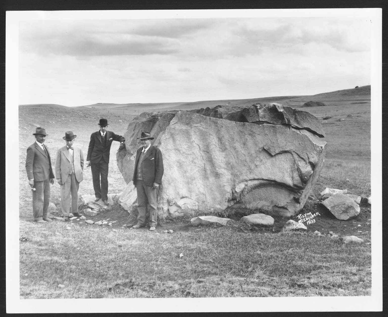 Joseph Bell DeRemer, Hynek Rybnicek, Ernst Warner and groundskeeper Dobson with uncut cornerstone for Capitol building