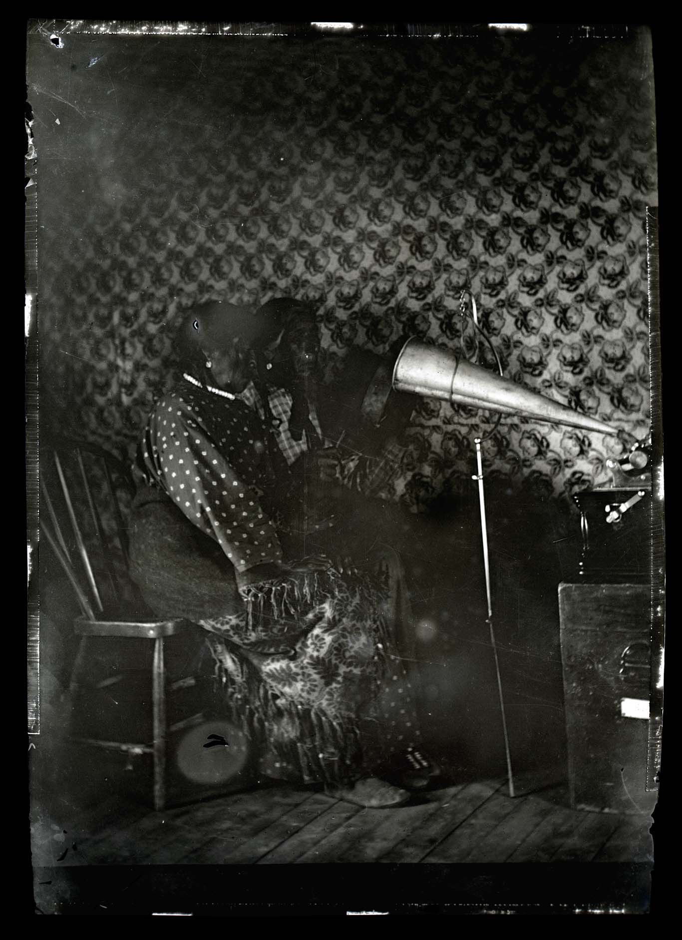 Little Crow’s wife and unidentified woman recording on a Victrola for Frances Densmore -negative.