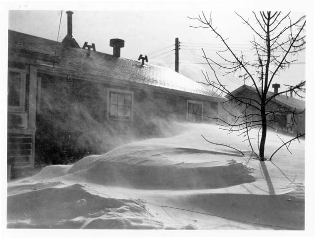 Snow drifting at building, Fort Lincoln